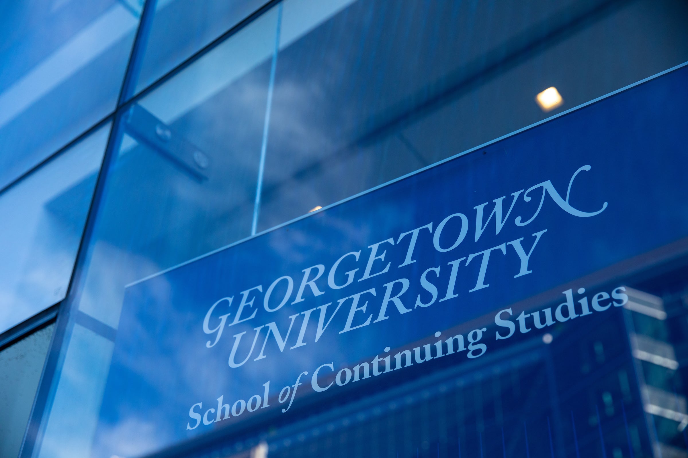 Close-up view of the Georgetown University's School of Continuing Studies logo.