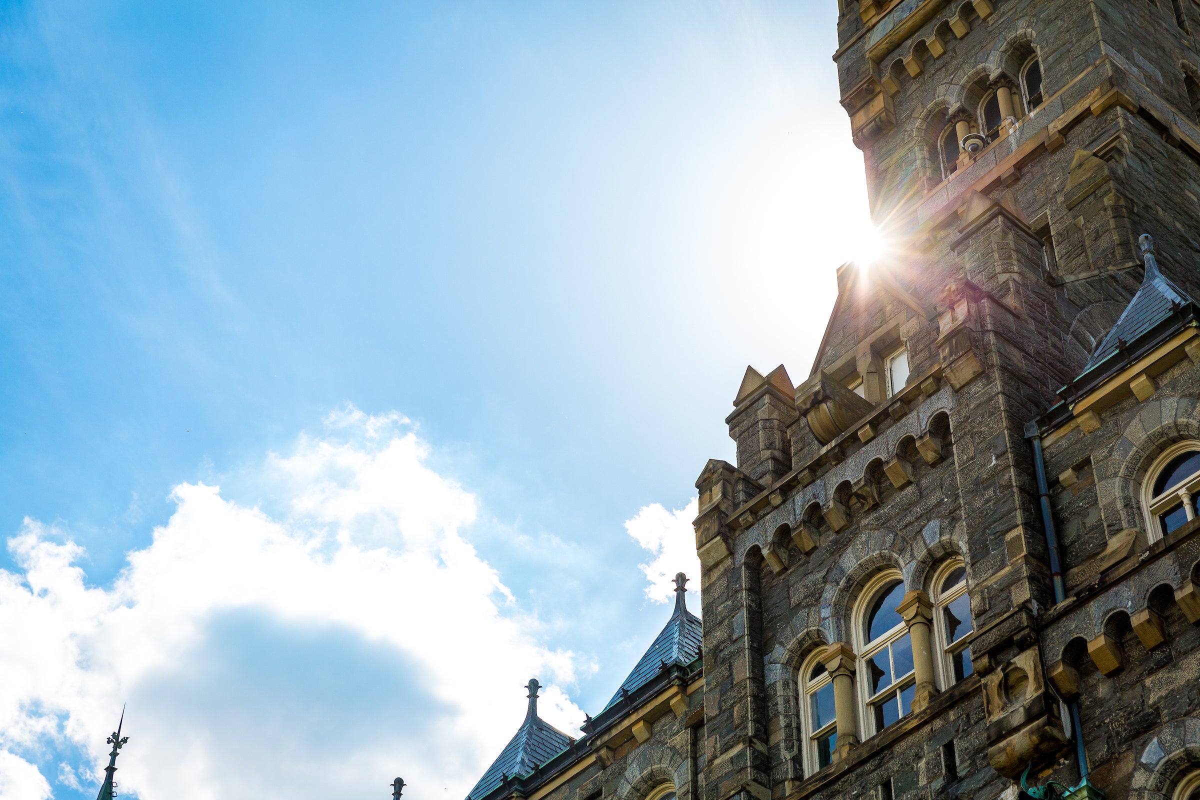 Partial view of Healy Hall and the sky.
