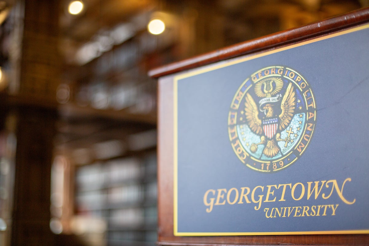 Podium inside Riggs Library with Georgetown University logo and seal.
